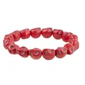 Macro shot of red skull bead bracelet with detailed gothic carvings for Halloween - Red