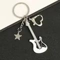 Detail of silver guitar keychain with white enamel, star charm, and heart clasp - Star White Guitar Keychain