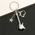Punk vintage guitar keychain with silver star charm and heart clasp on black background - Star Black Guitar Keychain