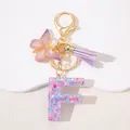 Detail of pink sequin resin letter F keychain with purple butterfly and tassel - Letter F Purple Tassel