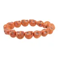 Macro shot of orange skull beads with detailed vintage crackle texture for Halloween - Orange