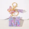 Detail of pink sequin resin letter M keychain with purple butterfly and tassel charm - Letter M Purple Tassel