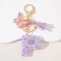 Detail of resin letter P keychain with pink sequins, purple butterfly, and silk tassel - Letter P Purple Tassel