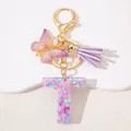 Detail of glitter resin letter T keychain with purple tassel and butterfly charm - Letter T Purple Tassel