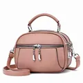 Vintage rose pink leather crossbody bag with three zipper compartments and lychee texture - Pink