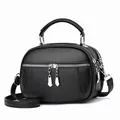 Retro black pebbled leather crossbody handbag with multiple zippers and silver hardware - Black
