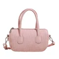 Chic pink pleated barrel handbag with vertical quilted texture and adjustable crossbody strap - Pink