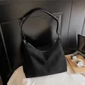 Minimalist black oversized matte faux suede crescent tote bag with silver hardware detail - Black