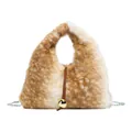 Faux fur handbag featuring brown and white animal print with a gold ball accent - Yellow