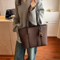 Dark brown large capacity tote bag in lychee texture leather with decorative charm - Brown