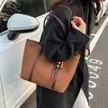Brown large capacity tote bag with woven tassel charm and shoulder strap - Red Brown