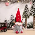 Christmas gnome doll with antlers and red felt hat standing in a festive snow scene - Male Doll Ornament (E-DD22)