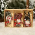 Three Christmas wooden gnome pendants in a display box with holiday tree background - Style D