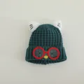 Detail of dark green knit hat with red glasses patch and cat ear accents for kids - Cat Style (TYJM04) / Dark Green