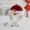 Detail of red festive baby winter hat with plush Santa doll and warm earflaps - Baby 2-5 Years Old / 3D Santa Doll Style