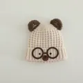 Detailed knit texture of a cream children's winter hat featuring cute bear ears and glasses - Bear Style (TYJM04) / Beige