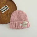 Close-up of pink knit beanie with coffee cup patch and ribbed texture detailing - 3-10 Years (Stretchy) / Pink