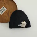 Detail of black knit beanie with cartoon coffee cup patch and white Honey Bear label - 3-10 Years (Stretchy) / Black