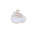 Close-up of a white enamel rabbit charm with pink ears and golden alloy metal frame - Right Facing Rabbit