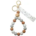 Silicone bead keychain with dark grey, tan, and marble white beads on golden ring - Red Brown Silicone With Clip