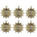 Detalle de seis dijes ojo turco dorados con pedrería para creación de joyería DIY - Dije de Ojo Transparente Base Dorada