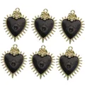 Detail of heart pendants with black enamel, gold spikes and rose accents in six-piece set - Gold Base Black Sacred Heart Eye