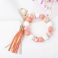 Dettaglio portachiavi con nappe, perle in silicone e perla con motivo cuore I love you - Stampa Cuore Rosa Scuro