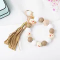 Close-up of beaded keychain with tassel, silicone beads and I love you engraving - Brown Heart Print