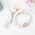 Detail of beaded keychain with colorful heart silicone beads and a white leather tassel - White Heart Print