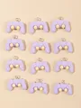 Flat lay of 12 purple resin game controller charms with yellow joysticks and metal rings - Purple And Gray Game Controller
