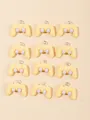 Top view of cream and lilac resin game controller charms for DIY jewelry making - Yellow Game Controller