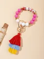 Detail of colorful silicone beaded bracelet with tassel and gold metal ring clasp - Red Floral (PZ2307159640)
