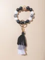 Kralen sleutelhanger armband met koeienprint houtparels en zwart grijs witte katoenen kwast - Zwart-wit Stijl