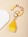Bracciale portachiavi bohémien con perline in silicone, nappa gialla e fiori stampati - Giallo Prospero (PZ2307159640)