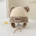 Detailed knit texture of beige winter baby hat with striped ears and HELLO embroidery - 3-6 Years / HELLO Series / Beige