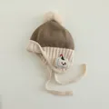 Detail of knit baby winter hat with fur pompom and cartoon puppy patch embroidery - Coffee / 1-3 Years