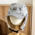 Detail of gray camouflage trapper hat with warm fleece lining and NYC authentic patch - Kids' Universal Model / Gray
