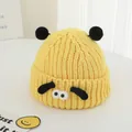 Detail of yellow knit toddler hat with black pom-poms and cute cartoon puppy dog ears - 2-7 Years (Elastic) / Yellow