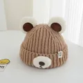 Close-up of brown knit baby hat featuring plush bear ears and soft textures for winter - 2-7 Years / Khaki