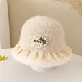 Close-up of beige plush bucket hat featuring lace trim and a plaid bow decoration - 52cm / Nice Label Style / Beige