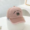 Close-up of pink corduroy kids cap with fuzzy fleece texture and M letter embroidery - Kids 3-8Y (50-54CM) / Pink
