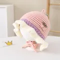 Detail of pink knitted baby bonnet with crochet cherries and ruffled lace edges - Toddlers 1-3 Years / Pink