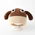Detailed close-up of knit texture on baby winter dog hat with brown long ears - Toddler (1-3 Years) / Dark Brown