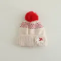 Detail of knit baby hat featuring red pom-pom, heart patterns and handmade lace patch - Kids 3-8 Years (Elastic) / Red Ball