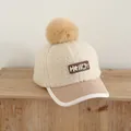 Winter kids baseball cap featuring beige faux lamb wool and a brown fluffy pom-pom detail - 50-54cm / Beige