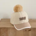 Berretto invernale bimbo in pelliccia sintetica beige con ricamo FIRST e grande pompon - Beige