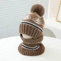 Detail of warm winter knit hat and neck warmer set with fluffy pompom and mountain pattern - Kids Ages 3-8 Stretchy / Light Coffee