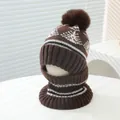 Detail of winter knit hat and neck gaiter set with snowflake patterns and brown fur pom-pom - Kids Ages 3-8 Stretchy / Dark Coffee