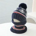 Detailed knit texture of winter hat and neck warmer with snowflake patterns and pom-pom - Kids Ages 3-8 Stretchy / Navy Blue