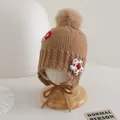 Detail of baby brown knit earflap hat with fluffy pom-pom and 3D floral accents - Children Elastic Style / Light Coffee